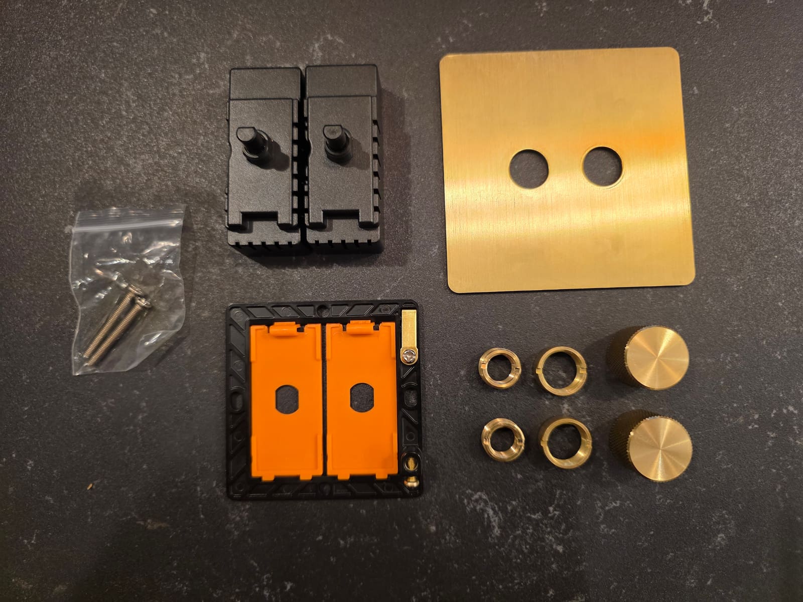 Repenic RD-250ZG dimmer disassembled into its module, mounting plate, brass fascia, knobs and screws